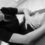 Holistic facial being given to a customer lying on their back